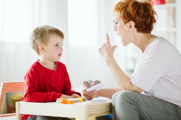 A child being taught at speech therapy