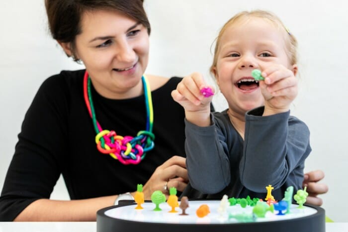 A child using figurines at therapy