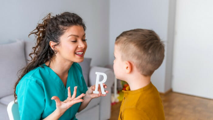 Speech Therapist vocalizing the letter R