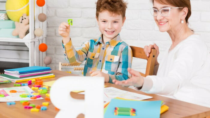 Child using letter blocks for speech therapy